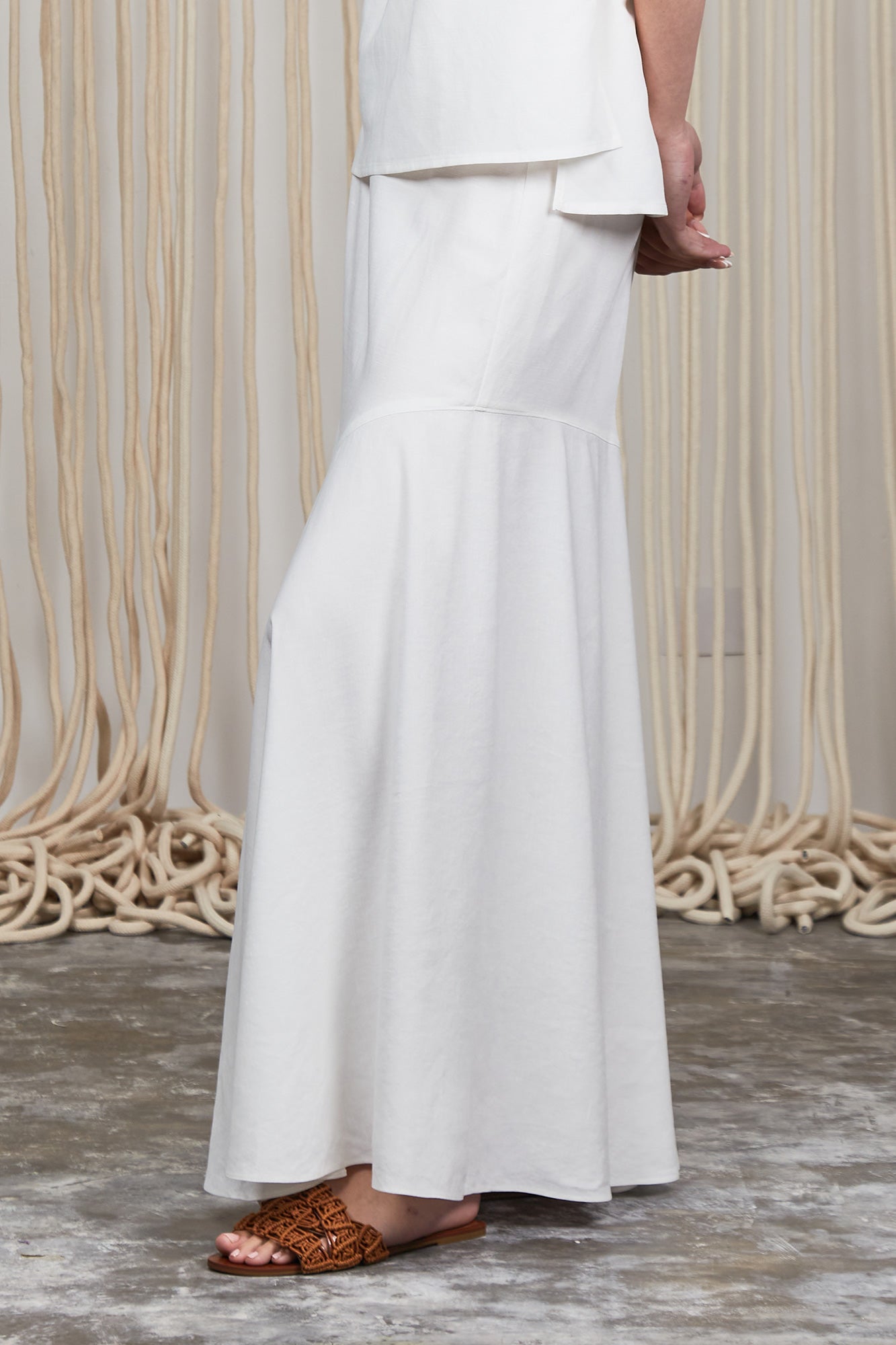 Penny Skirt in Off White with a high-waisted flowing silhouette, offering timeless elegance for any wardrobe.