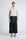 Pria Blouse in Prestine – Elegant sleeveless blouse in pima cotton with tonal V-neck, Greca trim, ruffle detail, and hem with pullers.