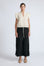 Pria Blouse in Prestine – Elegant sleeveless blouse in pima cotton with tonal V-neck, Greca trim, ruffle detail, and hem with pullers.