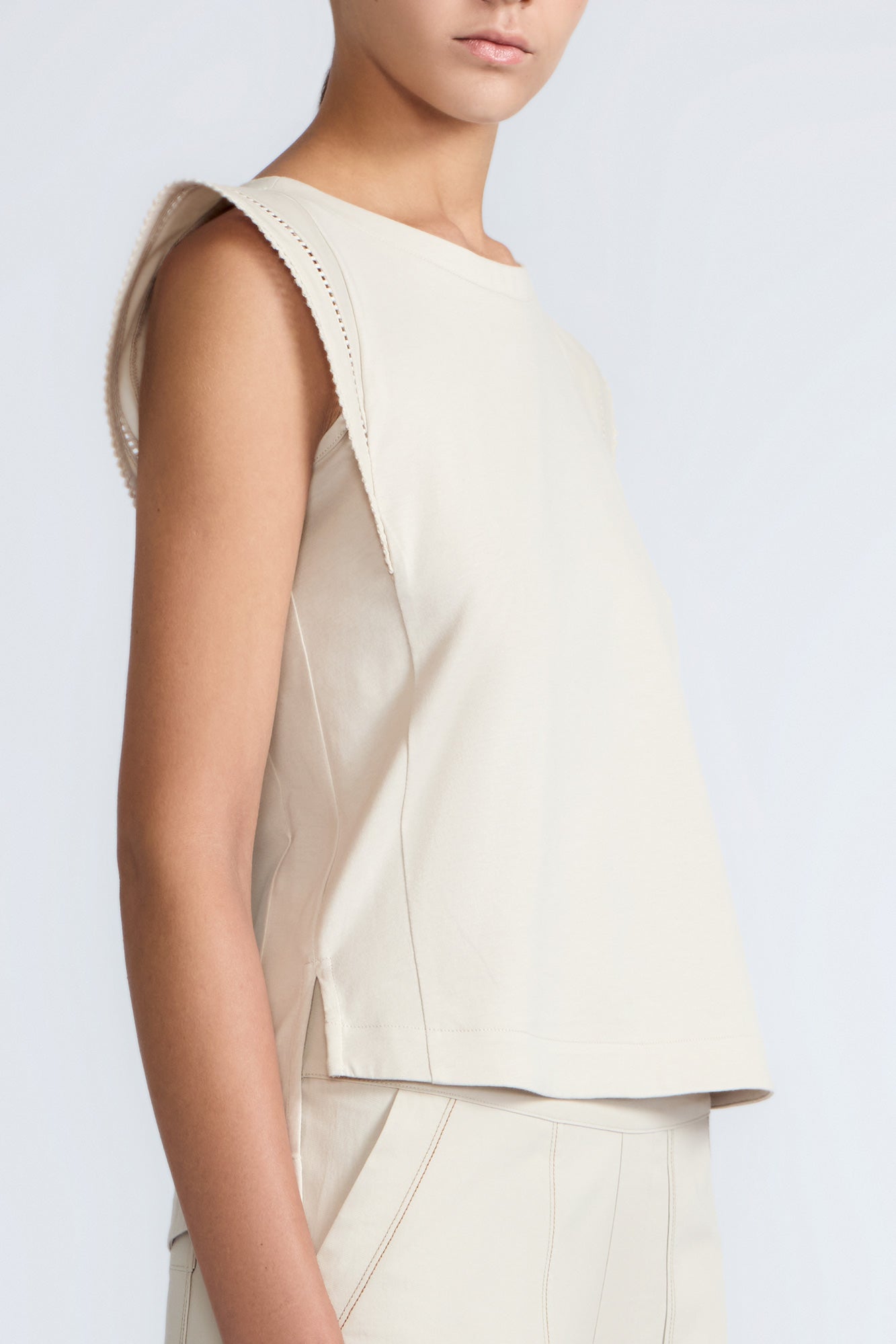 Regina Top in Prestine – Pima cotton knit top with round neckline, Greca lace detailing, side slits, and relaxed dropped sleeves.