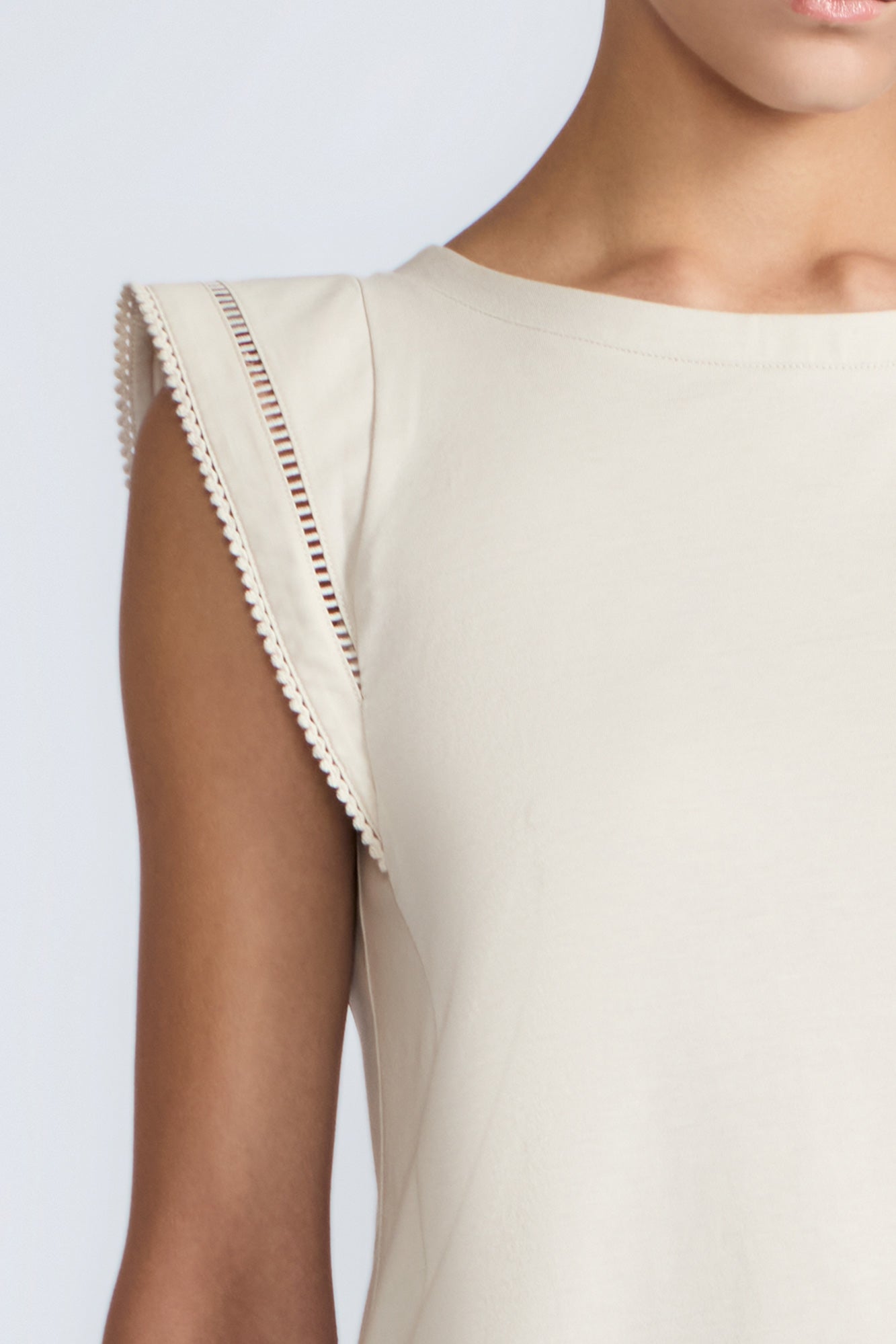 Regina Top in Prestine – Pima cotton knit top with round neckline, Greca lace detailing, side slits, and relaxed dropped sleeves.