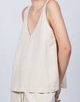 Ryan Top in Ecru featuring a flattering V-neckline and an adjustable drawstring waist for a tailored fit.