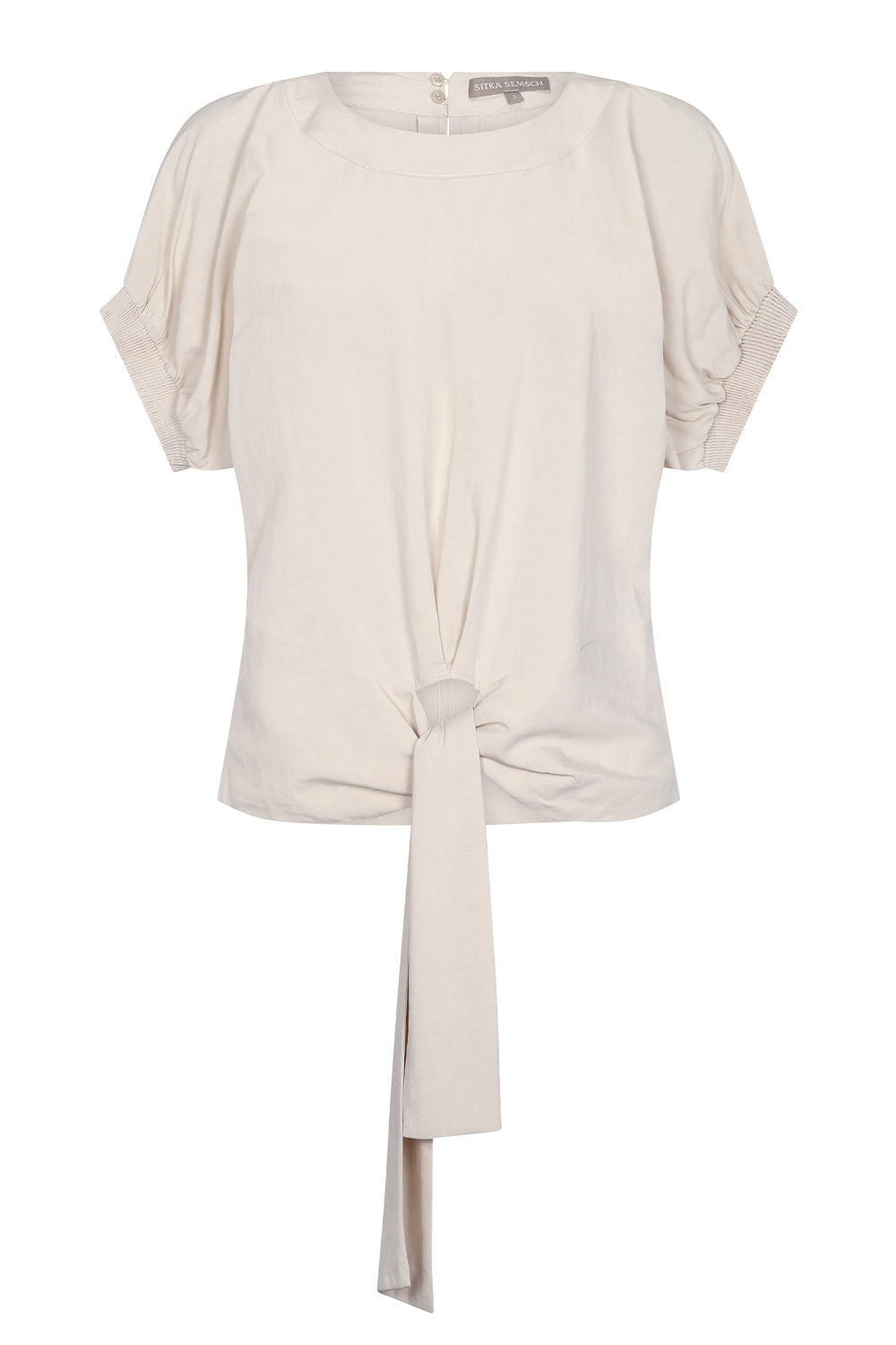 Shelby Blouse in Ecru with a round neck, button-back detail, elasticated short sleeves, and adjustable tie hem.