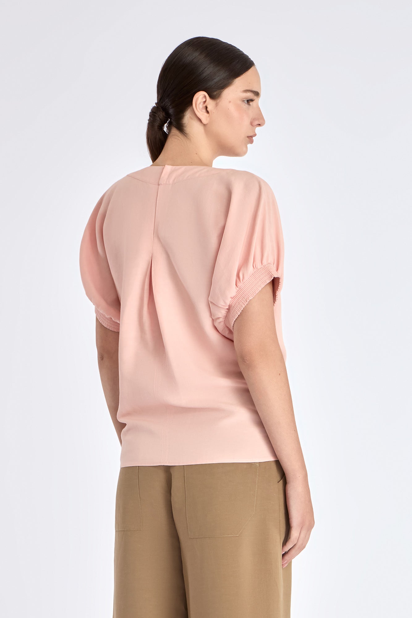 Shelby Blouse in Rose – Linen-blend blouse with round neck, elasticated sleeves, back button closure, and tie hem.