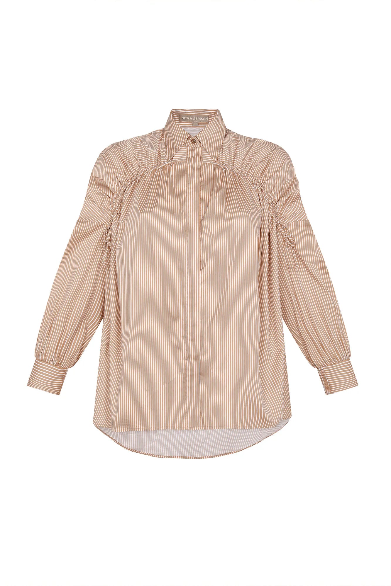 The Star Blouse in a timeless Camel, featuring its crisp shirt collar and the rich tone of its Peruvian cotton.