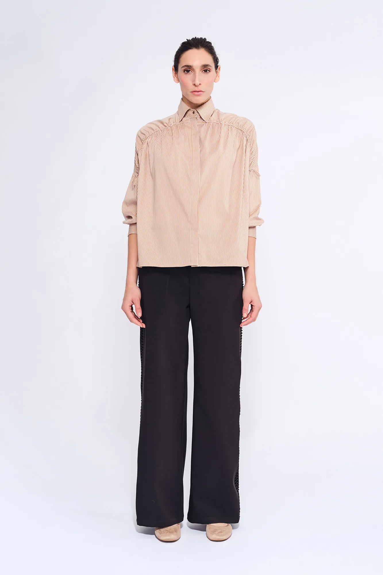 The Star Blouse in a timeless Camel, featuring its crisp shirt collar and the rich tone of its Peruvian cotton.