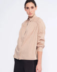 The Star Blouse in a timeless Camel, featuring its crisp shirt collar and the rich tone of its Peruvian cotton.