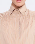The Star Blouse in a timeless Camel, featuring its crisp shirt collar and the rich tone of its Peruvian cotton.