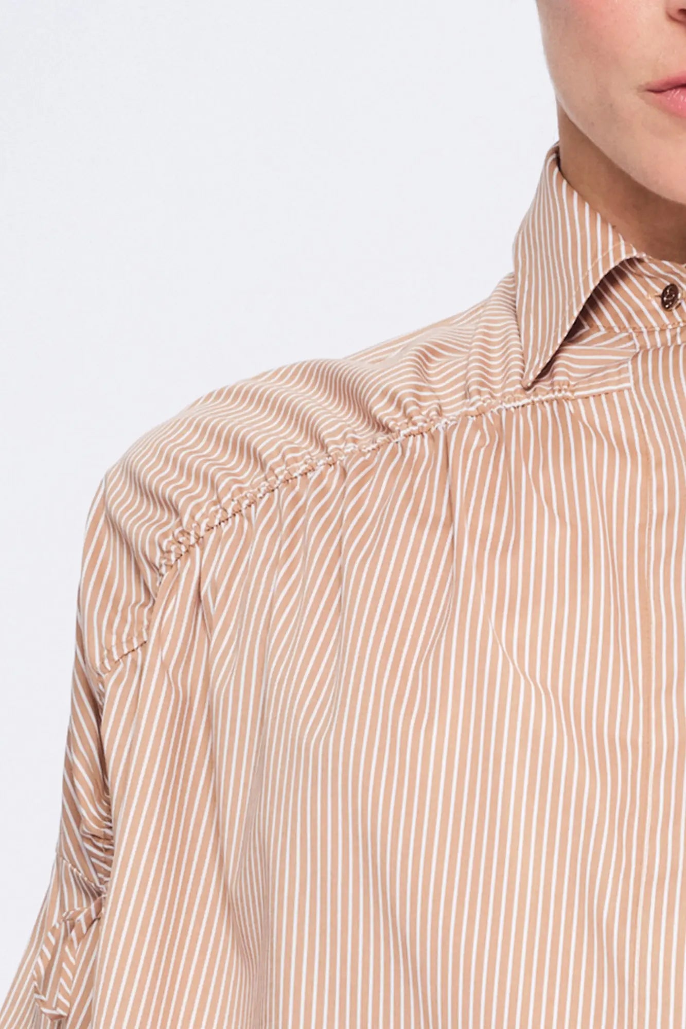 Side view of the Camel Star Blouse, showcasing the romantic volume of the adjustable gathered shoulder.