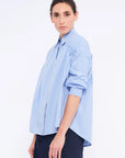 Side profile of the Light Blue Star Blouse, highlighting the soft volume of the adjustable gathered shoulder.