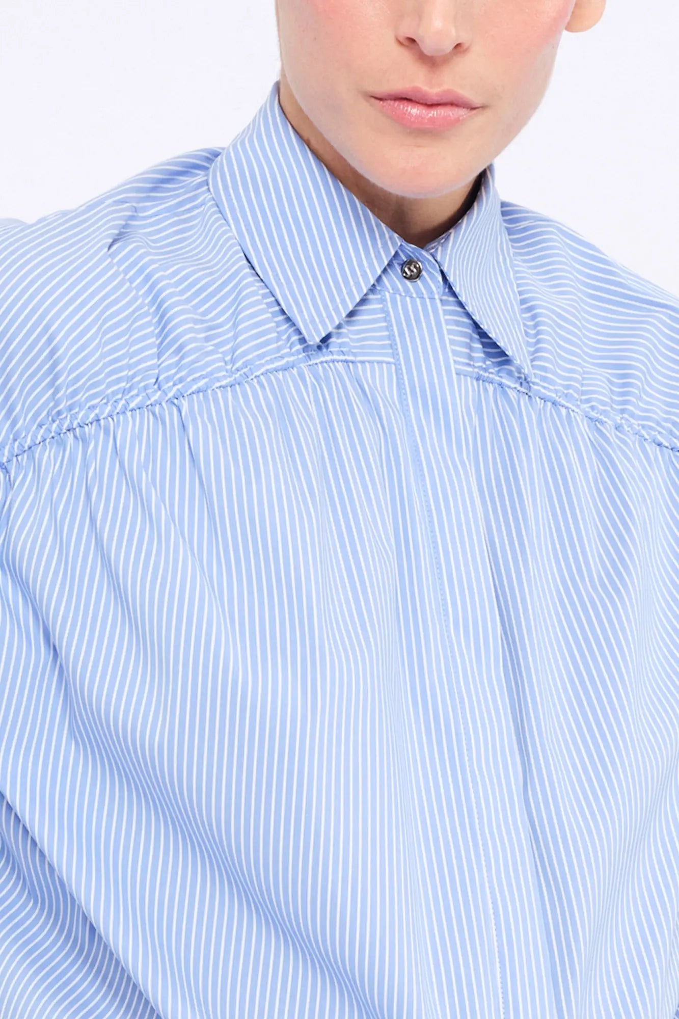 Front view of the Star Blouse in a classic light blue, showcasing its timeless tailoring.