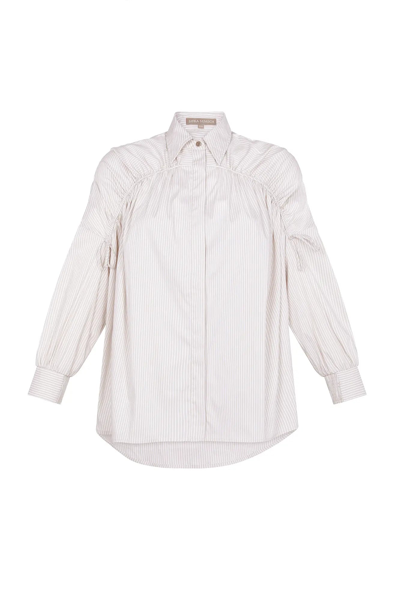 Front view of the Star Blouse in Sand, showcasing its classic collar and the elegant drape of its Peruvian cotton fabric.