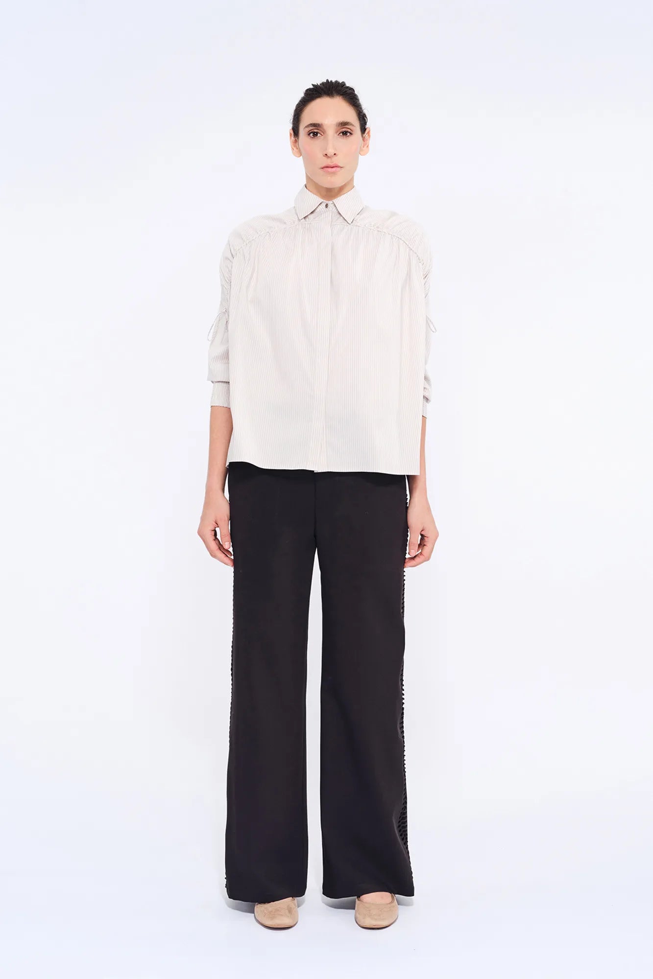 Front view of the Star Blouse in Sand, showcasing its classic collar and the elegant drape of its Peruvian cotton fabric.