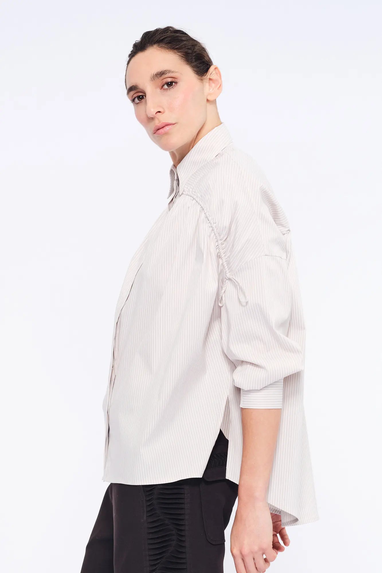 Side profile of the Sand Star Blouse, highlighting the soft, adjustable gathers at the shoulder.