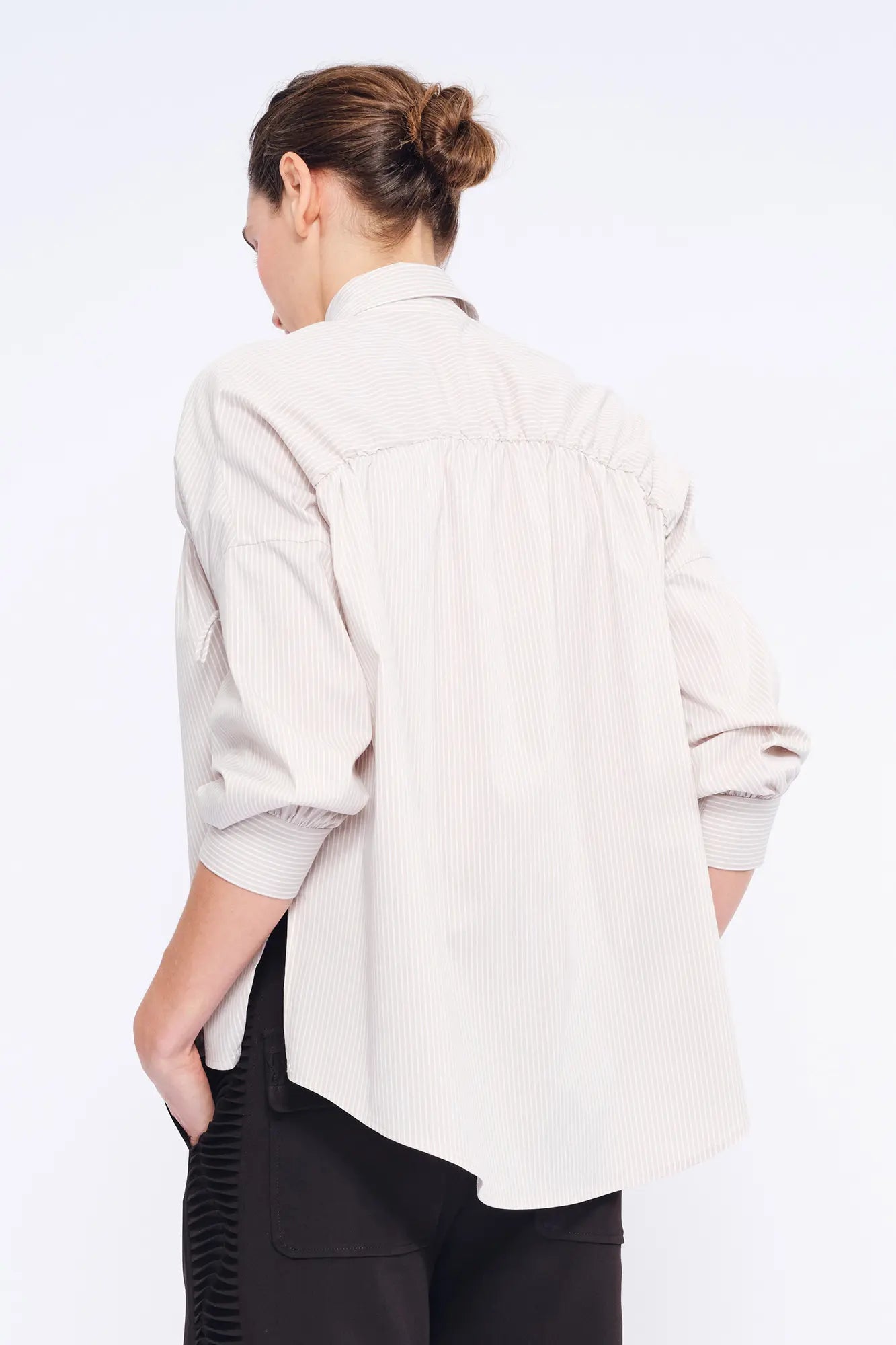 Clean back silhouette of the Star Blouse, a portrait of minimalist elegance.
