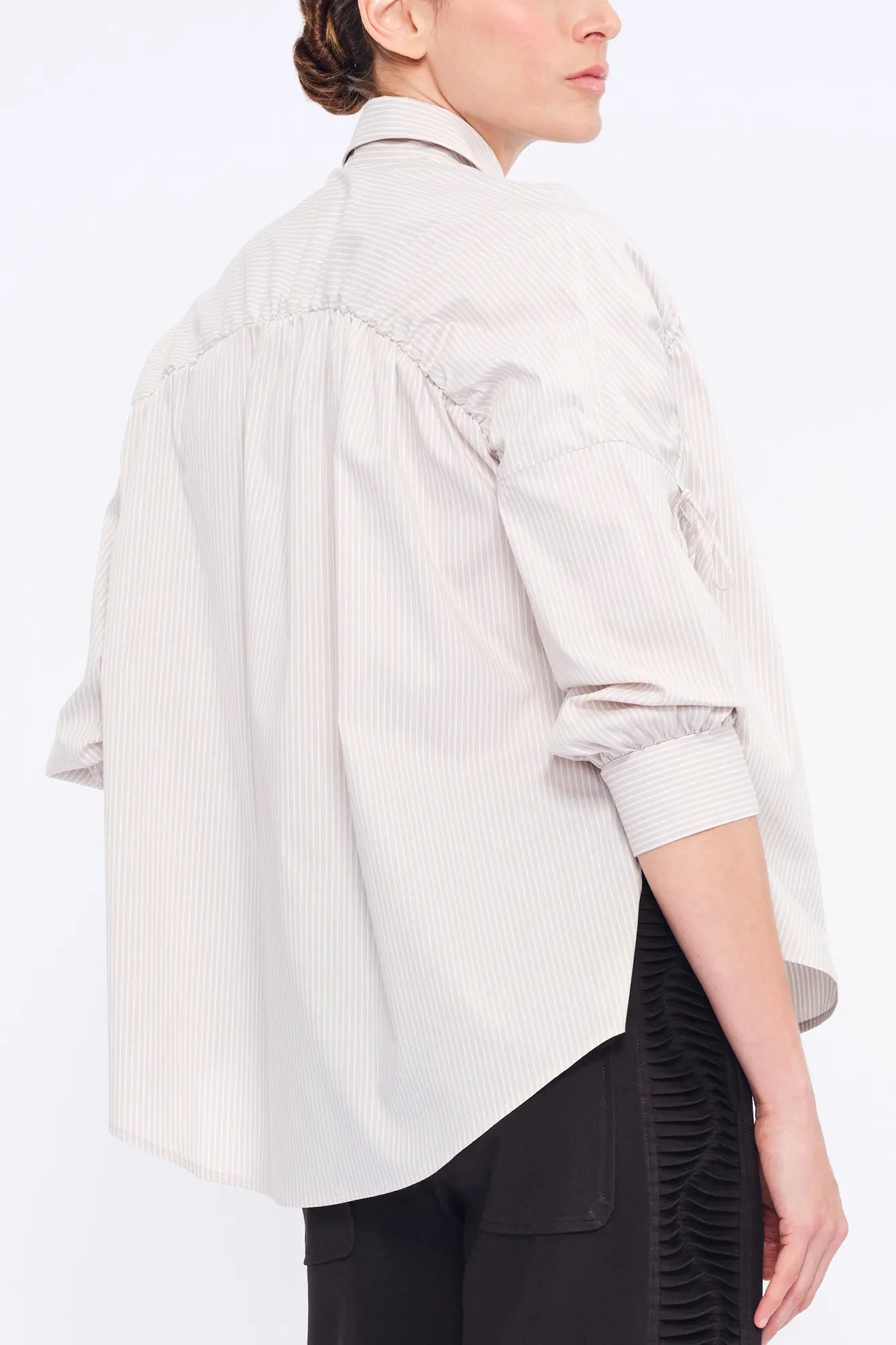 Clean back silhouette of the Star Blouse, a portrait of minimalist elegance.