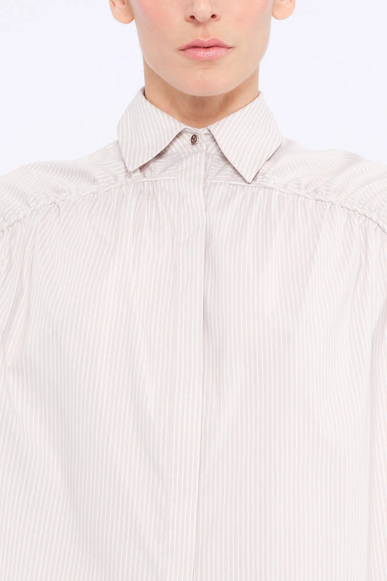 Front view of the Star Blouse in Sand, showcasing its classic collar and the elegant drape of its Peruvian cotton fabric.