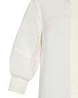 Tatiana Blouse in Off White with a modern shirt collar, hidden button placket, and airy 3/4 puff sleeves.