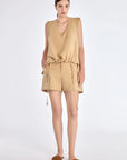The Valencia Blouse in a rich Camel hue, showing its sleeveless design and premium linen blend.
