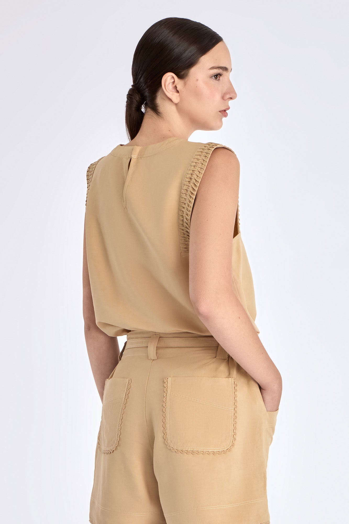 Elegant back silhouette of the Valencia Blouse in Camel.