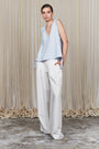 Veda Pant in Off White, wide-leg silhouette with functional back pockets for a tailored look.