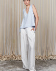 Veda Pant in Off White, wide-leg silhouette with functional back pockets for a tailored look.