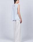 Veda Pant in Off White, wide-leg silhouette with functional back pockets for a tailored look.