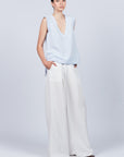 Veda Pant in Off White, wide-leg silhouette with functional back pockets for a tailored look.