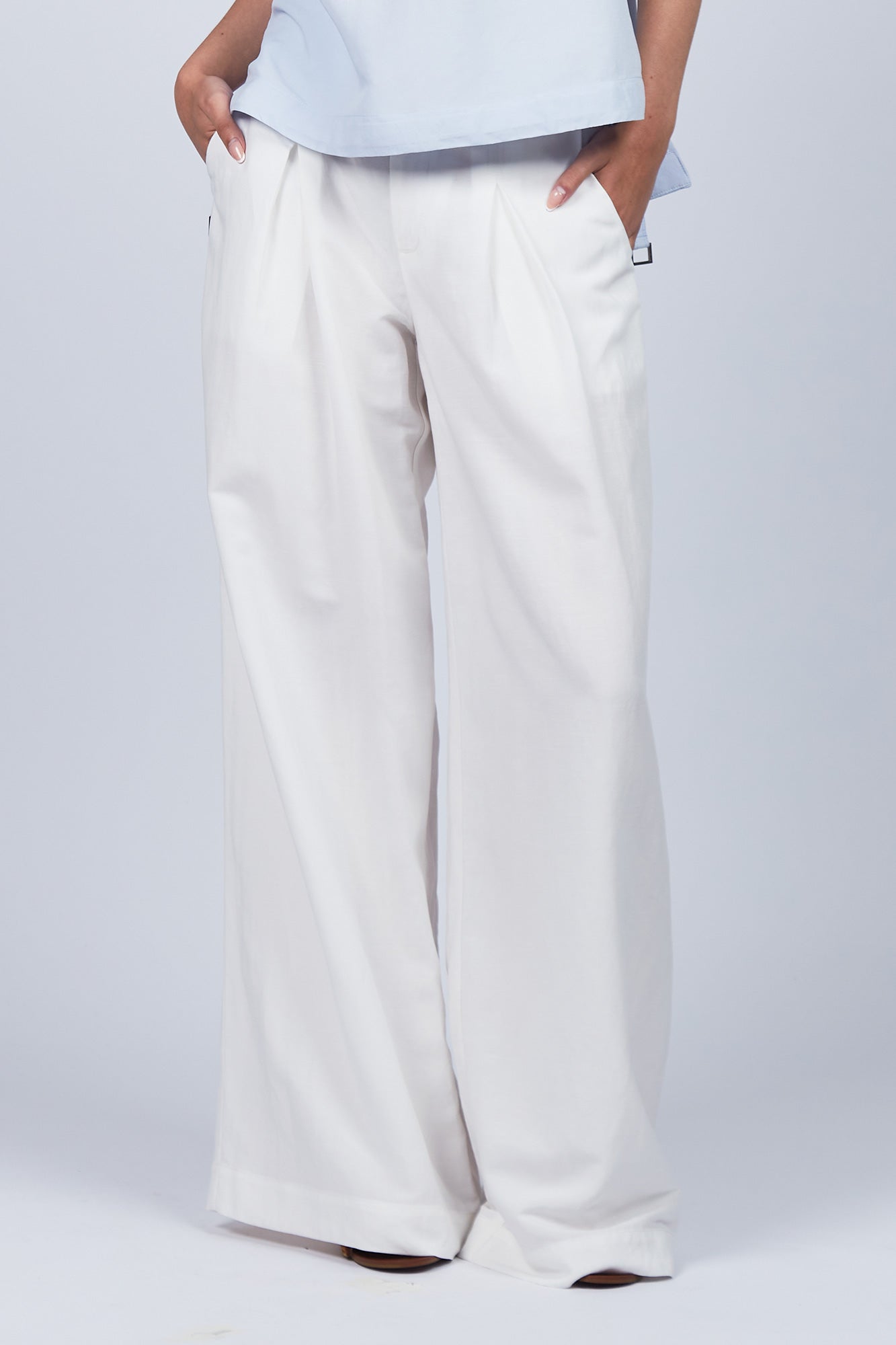 Veda Pant in Off White, wide-leg silhouette with functional back pockets for a tailored look.