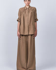 Veda Pant in Taupe, sophisticated wide-leg pants with minimalist design and functional details.