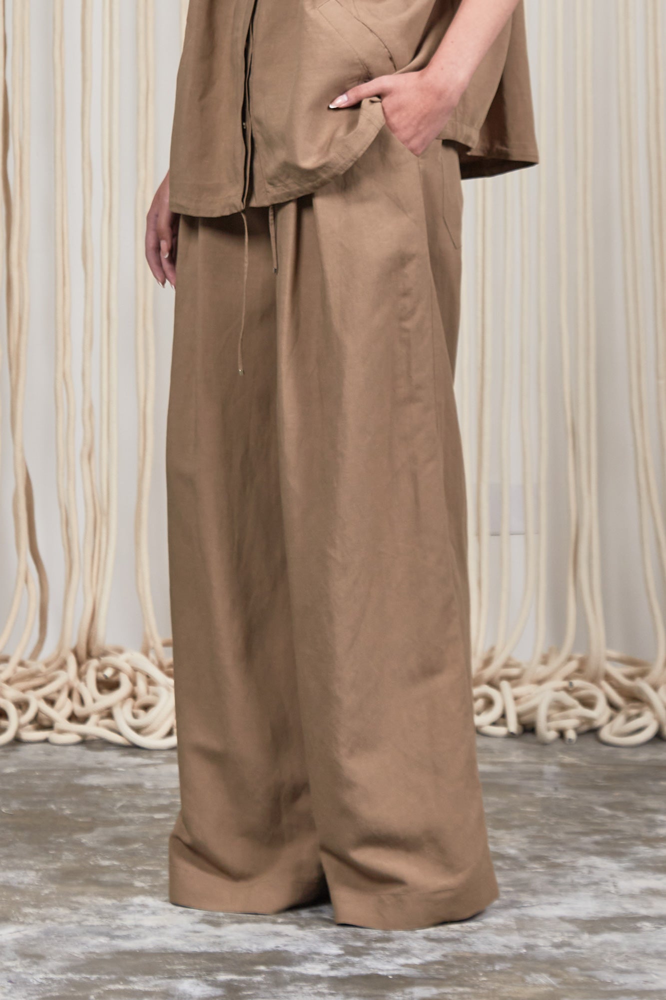 Veda Pant in Taupe, sophisticated wide-leg pants with minimalist design and functional details.