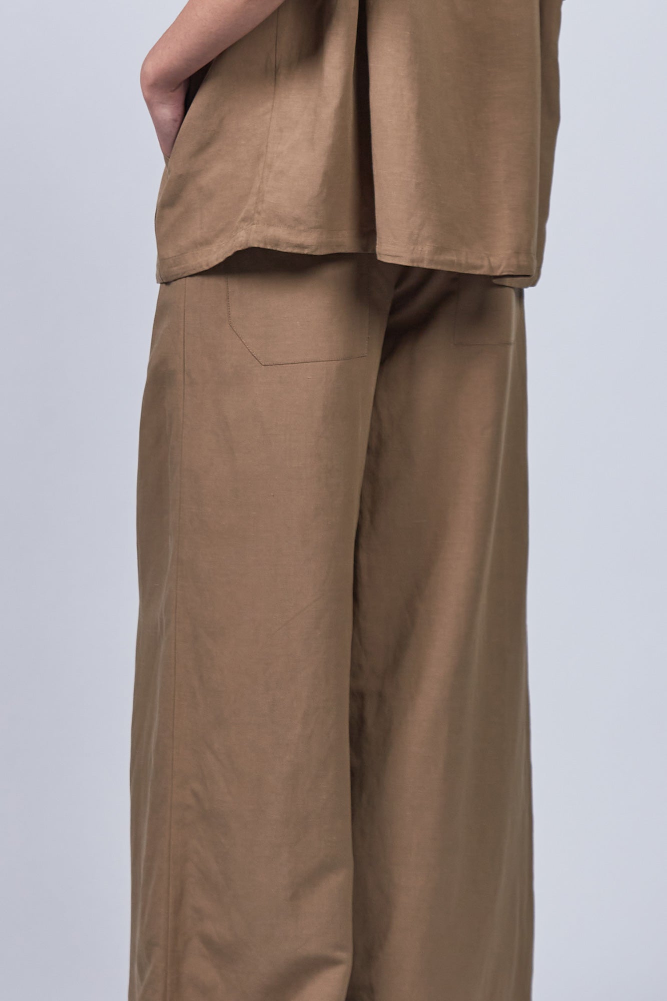 Veda Pant in Taupe, sophisticated wide-leg pants with minimalist design and functional details.