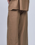 Veda Pant in Taupe, sophisticated wide-leg pants with minimalist design and functional details.