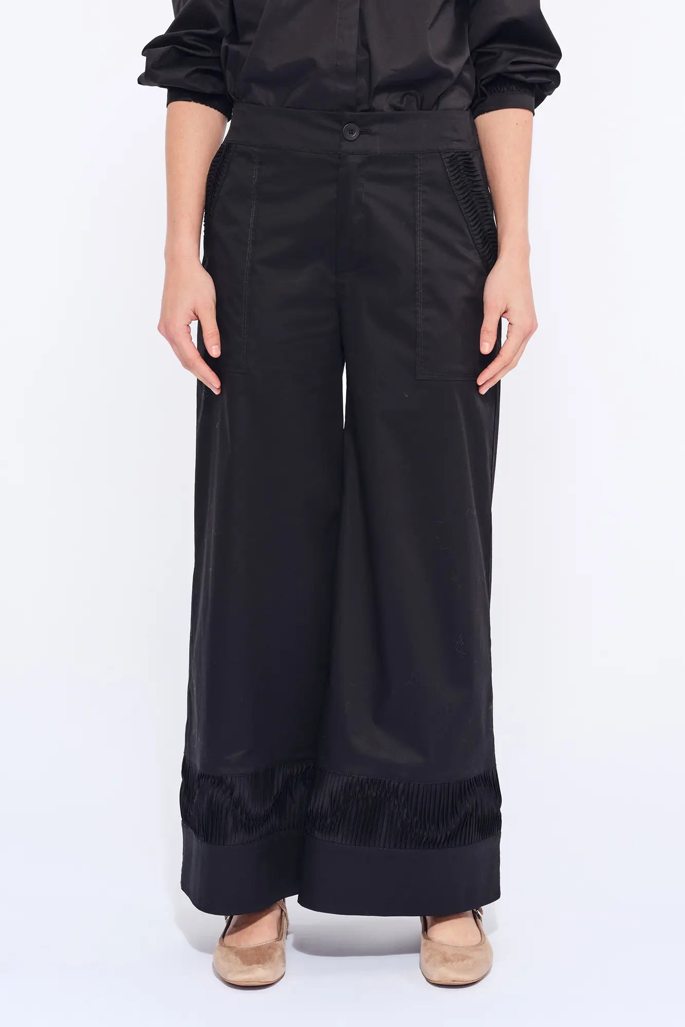 The Viena Trouser in essential black, showcasing its powerful wide-leg tailoring.