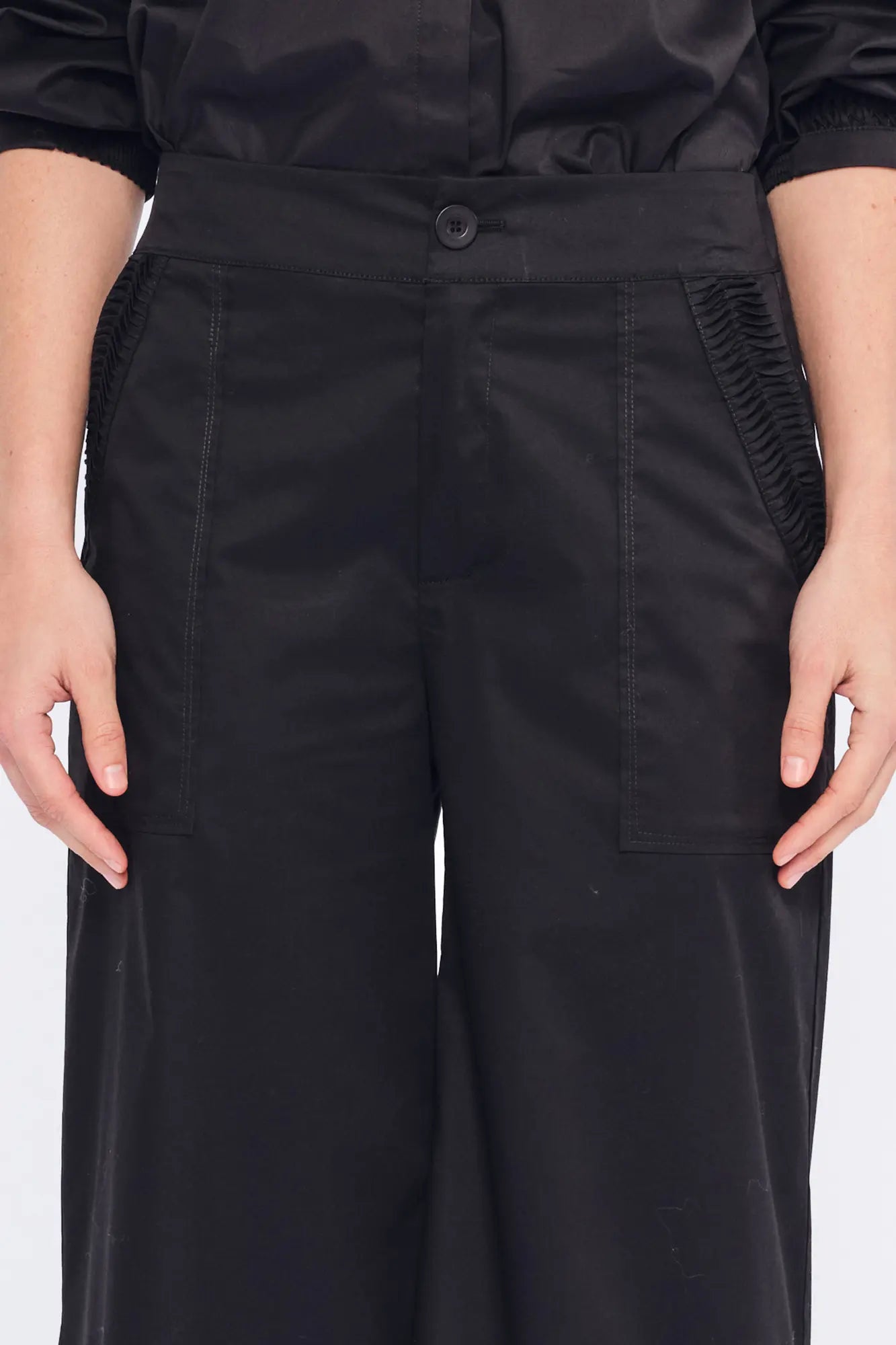 The Viena Trouser in essential black, showcasing its powerful wide-leg tailoring.