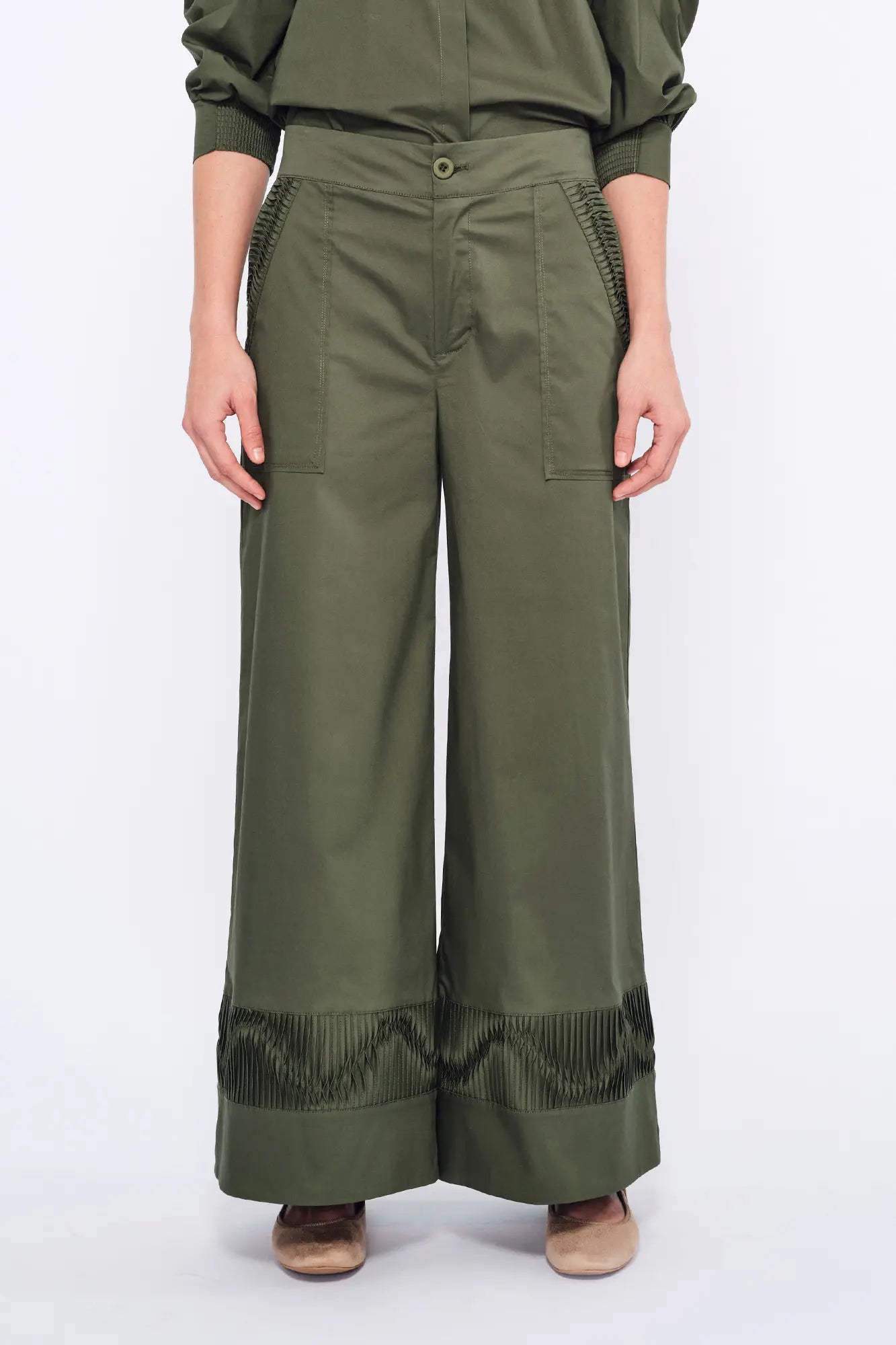 Front view of the Viena Trouser in Olive, showcasing its flowing wide-leg silhouette.