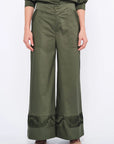 Front view of the Viena Trouser in Olive, showcasing its flowing wide-leg silhouette.