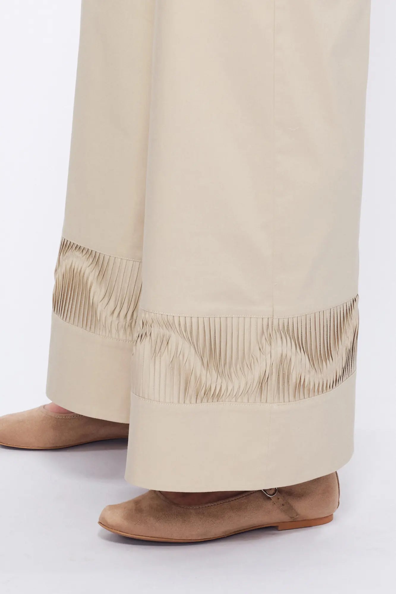 Close-up of the architectural, raised embellishment on the hem of the Pristine Viena Trouser.