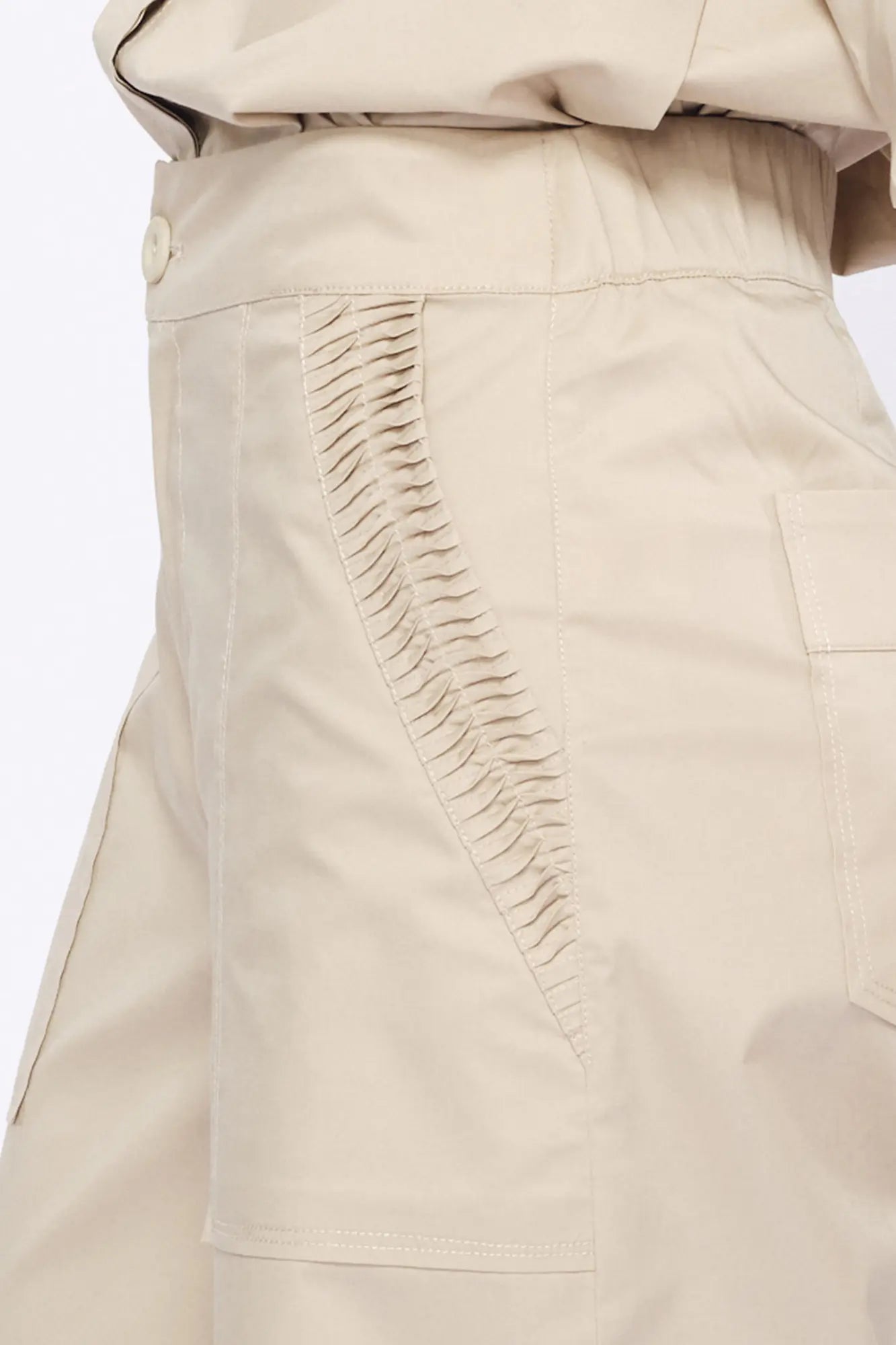 Close-up of the architectural, raised embellishment on the hem of the Pristine Viena Trouser.