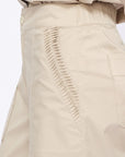 Close-up of the architectural, raised embellishment on the hem of the Pristine Viena Trouser.