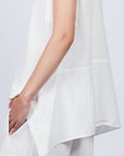 Zayla Blouse in Off White, elegant sleeveless blouse with an asymmetrical hem and shirt collar.