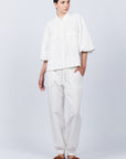 Zayla Jacket in Off White, refined elegance with front patch pockets and button closure.