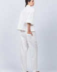 Zayla Jacket in Off White, refined elegance with front patch pockets and button closure.