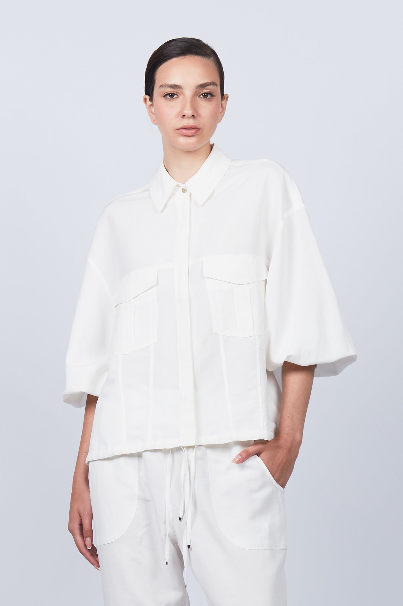 Zayla Jacket in Off White, refined elegance with front patch pockets and button closure.