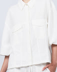 Zayla Jacket in Off White, refined elegance with front patch pockets and button closure.