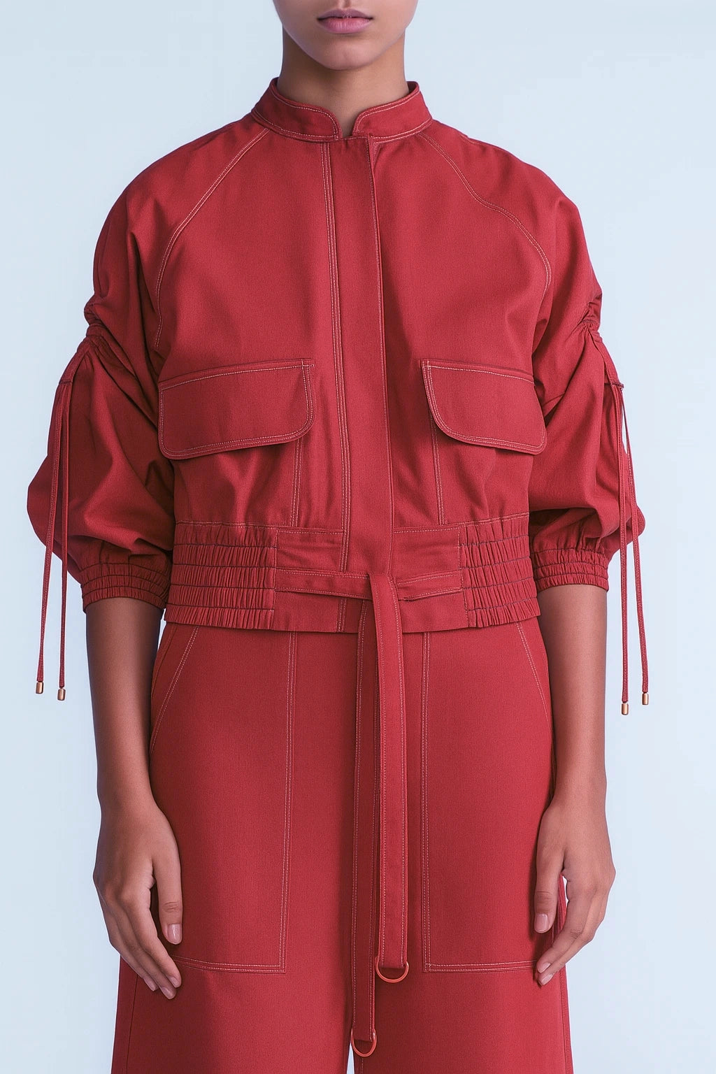 Red jacket with puffed sleeves and belt on a white background