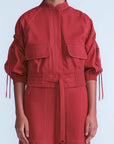 Red jacket with puffed sleeves and belt on a white background
